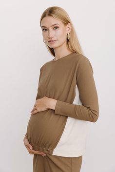 Product Details Maternity fit Fitted sleeves Ribbed lightweight material Gathered at elastic waist Model Model is 5'10" and wearing size XS. Versatile Brown Long Sleeve Top, Maternity Long Sleeve Cotton Tops, Taupe Long Sleeve Tops For Layering, Versatile Long Sleeve Neutral Top, Spring Maternity Long Sleeve Tops, Spring Maternity Top With Long Sleeves, Maternity Long Sleeve Tops For Spring, Neutral Long Sleeve Stretch Top, Versatile Cream Long Sleeve Tops