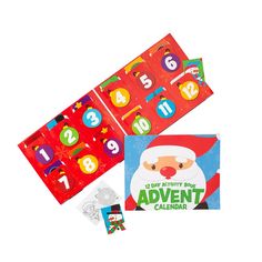 an assortment of christmas themed items including a calendar and sticker book with numbers on it