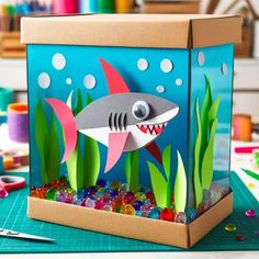 a box filled with gummy bears and a shark cut out of it's side