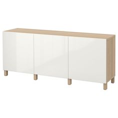 a white and oak sideboard with three doors