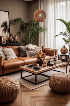 a living room filled with lots of furniture next to a large window and potted plants