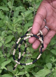 This Kanthi Mala is made of black Tulsi wood in brown tulsi which is worn by Radha Rani to please Syam Sunder. Traditional Hand-strung Black Mala, Traditional Black Hand-strung Mala, Traditional Black Jewelry Fair Trade, Traditional Black Bracelet With Wooden Beads, Traditional Black Bracelets With Wooden Beads, Kanthi Mala, Tulsi Mala, Radha Rani, Prayer Beads