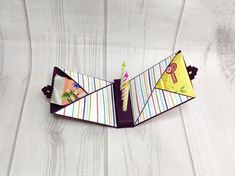 an origami birthday card holder on a table