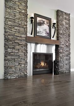 a living room with a fire place and stone fireplace