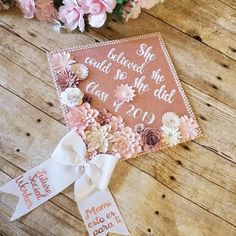 a graduation cap with flowers on it and the words, she heard so she did