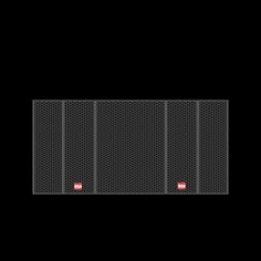 the back side of a black wall with red buttons on it and two rows of metal mesh