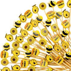 a bunch of sticks with smiley faces on them