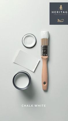 a paintbrush and some other items on a white surface with the words heritage chalk written below it