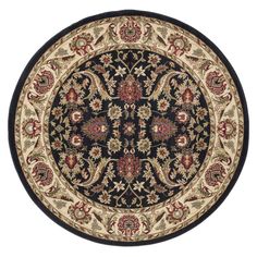 a black and beige rug with an ornate design on the center, surrounded by flowers