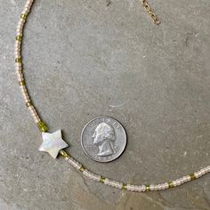 Mother of Pearl Star Choker with Peridot and Glass 14 kt Gold Filled Seed beads and GF clasp Sits to the side as a total statement piece. Fun to layer or wear alone. Our gemstone necklaces are all original designs by Lisa Beth and LDE Affinity Jewelry. They are hand crafted with passion and love in our Southern California studio. The beads are strung on soft-flex wire to provide strength, flexibility and longevity to your necklace. I pay close attention to detail because I want you to love your Green Star-shaped Handmade Jewelry, Handmade Green Star-shaped Jewelry, Star Choker, Peridot Color, Gemstone Necklaces, Peridot Gemstone, Pearl Shell, Plexus Products, Gemstone Necklace