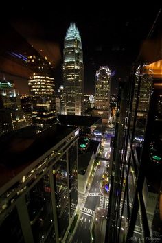 the city skyline is lit up at night