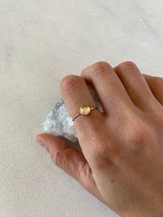 Natural rose cut 6mm crystal quartz takes a center stage in this delicate and minimal ring. Available in sterling silver, gold filled and solid 14k gold. The crystal is clear and faceted (rose cut). Solid gold sales are final. Thank you! * Featured ring-1mm gold filled, size 7 Dainty 14k Gold-filled Stackable Promise Rings, Minimalist Yellow Gold Moonstone Ring In Sterling Silver, Minimalist Yellow Gold Sterling Silver Moonstone Ring, Dainty Rose Gold Crystal Ring In 14k Gold, Gold Dainty Crystal Ring In Sterling Silver, Dainty Gold Crystal Ring In Sterling Silver, Minimalist Faceted Promise Ring, Dainty 14k Yellow Gold Moonstone Ring, Delicate 14k Gold Filled Stackable Promise Rings