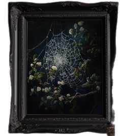 a spider's web on a branch with white flowers in the foreground and dark background