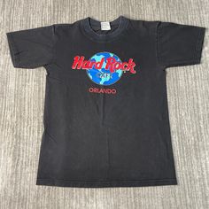 Vintage 2000s Hard Rock Cafe Orlando Restaurant Y2K Aesthetic Basic Essential Streetwear Black Graphic T Shirt Small Mens *Y10 Condition:  Excellent Used Condition  = No Flaws Measurements: Please see photos above for all measurements IF YOU BUY TWO OR MORE ITEMS USE THE CODE BUNDLE @ CHECK TO SAVE 20% WE SHIP WITHIN 24 HOURS AFTER PURCHASE! Please be aware that we do not offer free returns!! The Buyer is responsible for the cost of the return label. Follow us on TikTok & Instagram @findsnostalgic and tag us in your finds Y2k Style Black Pre-shrunk T-shirt, Y2k Black Pre-shrunk T-shirt, Y2k Black T-shirt With Logo Print, Black Y2k T-shirt With Logo Print, Orlando Restaurants, Hard Rock Cafe, Y2k Aesthetic, Hard Rock, Orlando