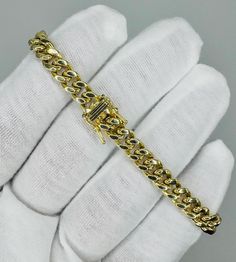 Texas Jewelers 10k Pure Yellow Gold Miami Cuban Link Bracelet 7mm, 8" Inches Long. The links are 10K PURE GOLD and have a Lobster lock on bracelet.  These Beautiful bracelet will not tarnish, discolor, or fade because they are Pure 10K Gold. We also have them in various another length. Please feel free to contact us by Etsy message.  Metal Purity: 10k Pure Yellow Gold  Weight: (9-12) Grams Length: 8" inch Width of chain: 7mm (Approx.) Lock Type: Box Lock Condition:Brand New Gender: Unisex                                                                                                The weight are only approximate and might be slightly different.  Shipping: So sorry we don't ship our item out of country. We make our item in USA & Sell USA customer only.  We typically ship on the same or nex Cuban Bracelet, Miami Cuban Link, Miami Cuban, Cuban Link, Pure Gold, 10k Gold, Beautiful Bracelet, Link Bracelets, Miami