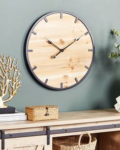 a wooden clock on the wall above a table