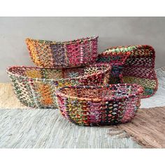 multicolored woven baskets stacked on top of each other