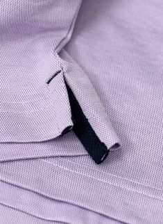 Runs small. Considered a Slim fit; fitted through the chest, armholes and sides Inspired by the effortless style worn in Como, our Ultra-Luxurious Perfect Polo Shirt with Band, in Lavender is meticulously crafted from the finest mercerized cotton and breathable technical fibers in the world. The mercerization process adds ultra-smoothness and softness, and the result is the most luxurious polo shirt, engineered to keep you cool all day long. We have added bespoke design elements such as a subtle Lavender Long Sleeve Cotton Top, Relaxed Fit Lavender Cotton Shirt, Formal Stretch Cotton Shirt, Classic Purple Formal Tops, Classic Formal Purple Tops, Purple Short Sleeve Work Shirt, Classic Fitted Purple Shirt, Purple Short Sleeve Shirt For Work, Fitted Cotton Lavender Tops