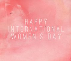 the words happy international women's day written in white on a pink watercolor background