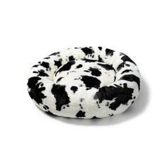 a black and white cow print dog bed