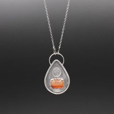 A hand stamped butterfly sits atop a beautiful carnelian gemstone framed in sterling silver.  The entire pendant was made by hand from sterling silver which has been oxidized and hangs from a delicate sterling silver chain.The pendant measures approximately 1 3/4 x 1 inch (4 x 2.8 cm).  The chain measures 18 inches in length. Silver Teardrop Carnelian Jewelry, Silver Carnelian Necklace With Large Pendant, Silver Carnelian Teardrop Jewelry, Silver Carnelian Jewelry With Large Pendant, Butterfly Necklace, Saint Louis, Perfect Christmas Gifts, Sterling Silver Chain, Promise Rings