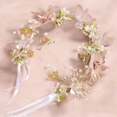 Elevate your wedding day look with our enchanting Floral Bridal and Flower Girl Headband. Crafted with delicate blooms and soft greenery, this stunning accessory adds a touch of romance and whimsy to any ensemble. Designed to complement both the bride and her little counterpart, it's perfect for creating a harmonious, ethereal aesthetic. Lightweight and adjustable, it ensures comfort without sacrificing style.  Size: - Wreath Diameter 14cm - Adjustable to desired size  Materials: - Plastic, Poly Flower Head Piece, Flower Girl Headband, Ethereal Aesthetic, Flower Girl Headbands, Headband Flower, Wedding Headband, Floral Bridal, Girls Headbands, Bridal Hair Accessories