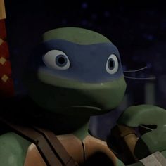 a close up of a cartoon turtle holding a flag