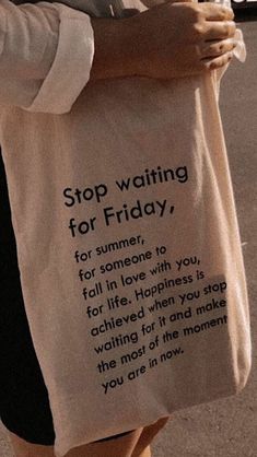 a woman carrying a tote bag that reads stop waiting for friday, for someone to fall in love with you