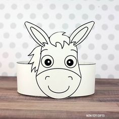 a paper cup with a donkey face on it