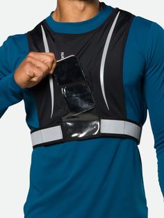 A unique reflective lightweight and stretchy knit vest that fits perfectly over your running gear and features a Clearview front pocket designed for Smartphones. Best For: Running, Hiking, Walking Black Reflective Functional Activewear, Black Reflective Activewear For Running, Black Functional Activewear With Reflective Details, Sporty Vest With Pockets For Sports, Practical Black Vest For Outdoor Activities, Black Practical Vest For Outdoor Activities, Stretch Functional Running Vest, Reflective Nylon Activewear For Sports, Reflective Nylon Activewear For Running