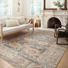 a living room filled with furniture and a fire place