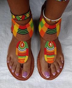 Our Maasai Sandals are handmade by talented artisans ("fundis") in Kenya, East Africa. Made from 100% original African fine beads, the colorful designs are usually created by skilled women, who weave intricate designs with the use of fishing wire. The inside leather sole and outside rubber sole are cut by hand using a pattern. Known to be very comfortable, one can wear these sandals with absolutely anything, as they will complement any outfit. We offer variety of sizes. Kindly select your size w African Slippers, Beads Sandals, African Bohemian, Copenhagen Diet, Cruise Vibes, Beaded Leather Sandals, African Sandals, African Shoes, Bohemian Sandals