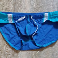 New M Light Blue Blue Stretch Boxer Briefs For Beach Season, Blue Sporty Boxer Briefs For Beach, Blue Brief Swim Trunks For Beachwear, Sporty Light Blue Swimwear For Swimming, Blue Stretch Brief Swim Trunks, Blue Fitted Boxer Briefs For Summer, Summer Fitted Blue Boxer Briefs, Fitted Blue Boxer Briefs For Summer, Blue Brief Swim Trunks