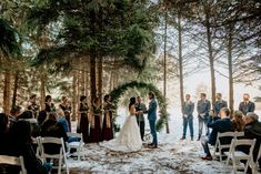 a couple getting married in the woods