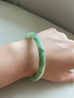 "🌈 Jade Bangle 57.0mm (2.24\"), Round Shape, Light Green 🌷 Untreated Natural Jadeite/ Grade A Jade/ Certified 🌷 Jade from Myanmar/ Burma 🌷 100% handmade carving 🌷 Inner diameter : 57.0mm / 2.24\" 🌷 Shape : Round 🌷 Color : Light Green 🌷 Free standard shipping from Hong Kong with tracking included 🌷 Take approximately 7-21 days to arrive worldwide ❤️ In Chinese Culture: Young people wear jade pendant will have a prosperous life, attracts good luck and friendship Old people wear jade penda Green Carved Round Bangle, Carved Round Bracelets For Wedding, Carved Round Wedding Bracelets, Wedding Carved Round Bracelets, Carved Jade Round Bracelets, Carved Jade Bracelets, Formal Jade Bangle Bracelet, Vintage Jade Round Bracelets, Vintage Round Jade Bracelets