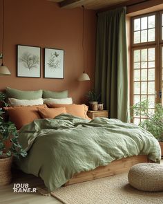 a bed with green sheets and pillows in a bedroom next to a window, potted plants on the floor