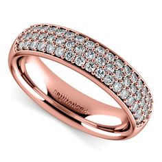 a white gold wedding band with rows of diamonds