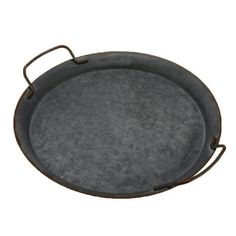 an old cast iron tray with handles