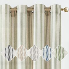 the curtains are lined up with different patterns