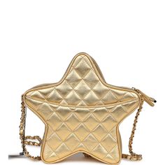 This Chanel star bag is in metallic gold lambskin leather with gold tone hardware and features a half moon back pocket, zip top closure and an interwoven gold tone chain link and gold leather shoulder strap.The interior is lined in gold leather and canvas with two open slip pockets on each wall.Collection: 24C (RFID)Origin: ItalyCondition: New and never wornAccompanied by: Chanel box, Chanel dustbag, carebook, RFID and retail UPCMeasurements: 8.5" width x 7.25" height x 2" depth; 19" strap drop Gold Leather Shoulder Bag With Gold-tone Logo Plaque, Designer Gold Shoulder Bag With Zipper Closure, Designer Gold Shoulder Bag With Zipper, Luxury Gold Bag With Zipper Closure, Gold Crossbody Bag With Gold-tone Logo Plaque, Star Bag, Chanel Box, Leather And Canvas, Backpack Tote Bag