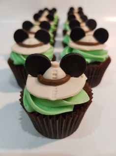 mickey mouse cupcakes with green frosting and black ears