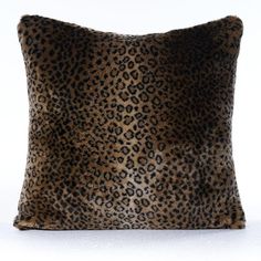 a leopard print pillow on a white background