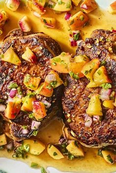 grilled steaks with potatoes and salsa on a white plate, ready to be eaten