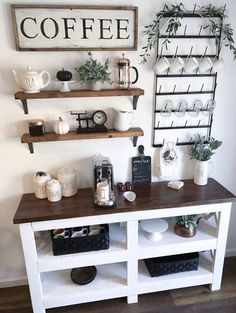 a coffee bar with shelves and cups on it, along with other items such as plants