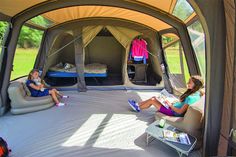 girls sitting in a large tent Huge Camping Tents, Big Camping Tents, Best Tent Camping Setup, Inside Tent Ideas Camping, Big Tents For Camping, Tent Set Up Ideas Inside, Amazing Tents, Bedroom Tent, Living In A Tent