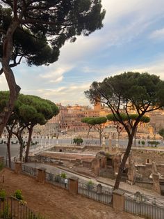 the ancient city is surrounded by trees and buildings