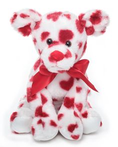 a red and white teddy bear with hearts on it