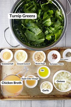 the ingredients for this salad are shown in bowls on a baking tray, including spinach leaves, onions, turmp greens, chicken broth and garlic