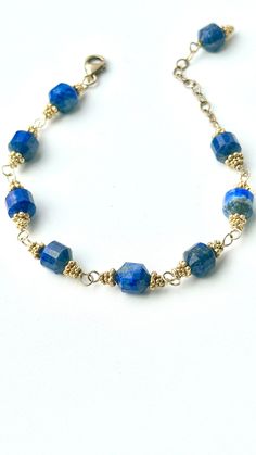 "Gorgeous Old World faceted Lapis Barrels linked in by the most beautiful Roman inspired vermeil etched discs.  9\" length 18kt gold fill hand wrought hammered framework  18 kt gold fill chain allowing to hook anywhere in chain for desired lengths  Since the earliest of times, lapis lazuli has been associated with royalty, strength and courage, wisdom and intellect, friendship and truth. From antiquity, lapis lazuli has been worn in the belief that it will ward off evil." Faceted Gold Jewelry In Recycled Gold, Artisan Gold Jewelry With Faceted Beads, Lapis Lazuli Bracelet, Mermaid Earrings, Mala Bracelet, Gold Filled Jewelry, Gold Filled Chain, Handmade Design, Chain Link Bracelet