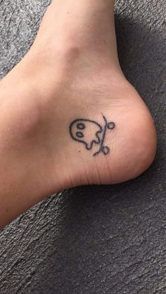 a person with a small tattoo on their foot